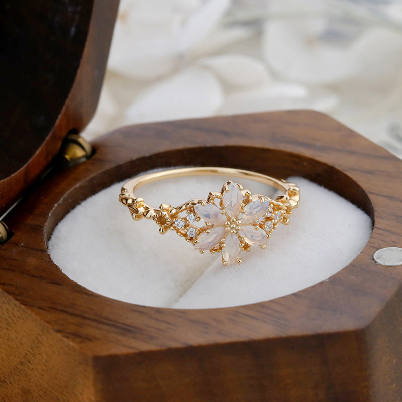 A light luxury Tanzanite zirconium/artificial opal ring