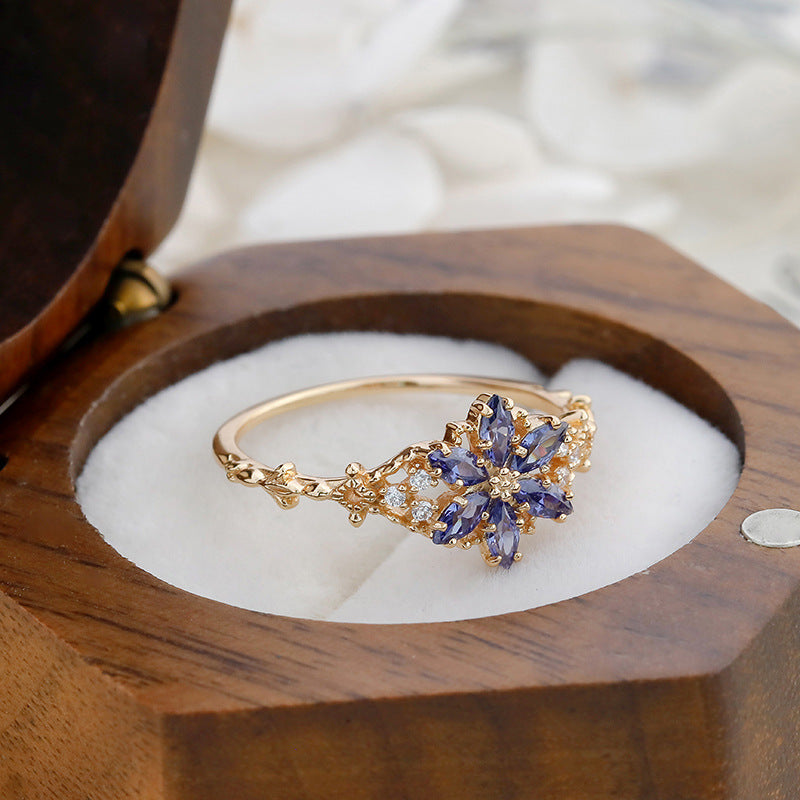 A light luxury Tanzanite zirconium/artificial opal ring