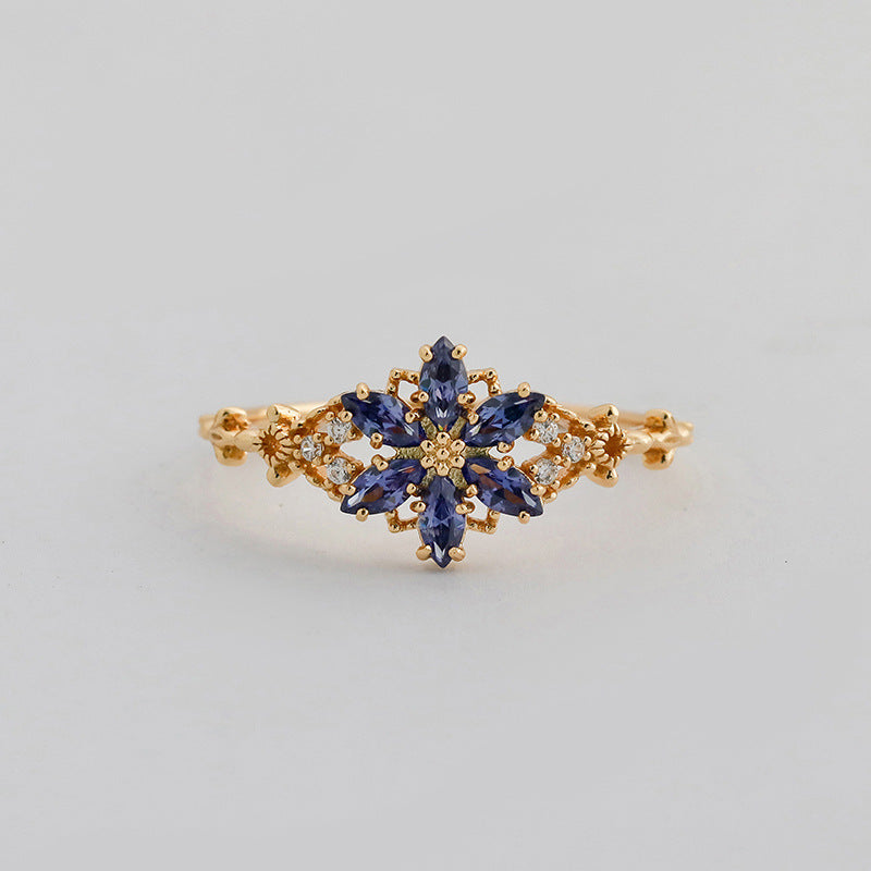 A light luxury Tanzanite zirconium/artificial opal ring
