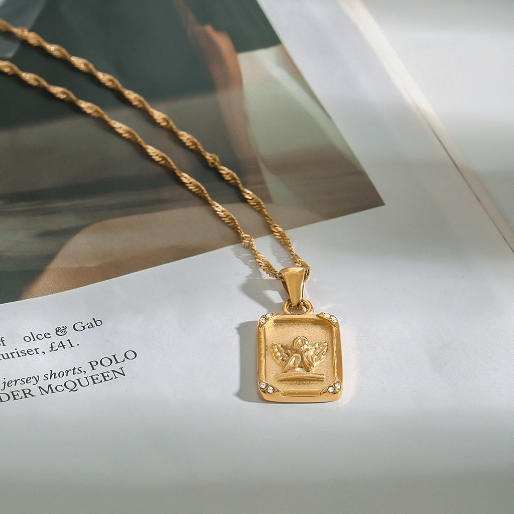 Square-shaped relief angel pendant