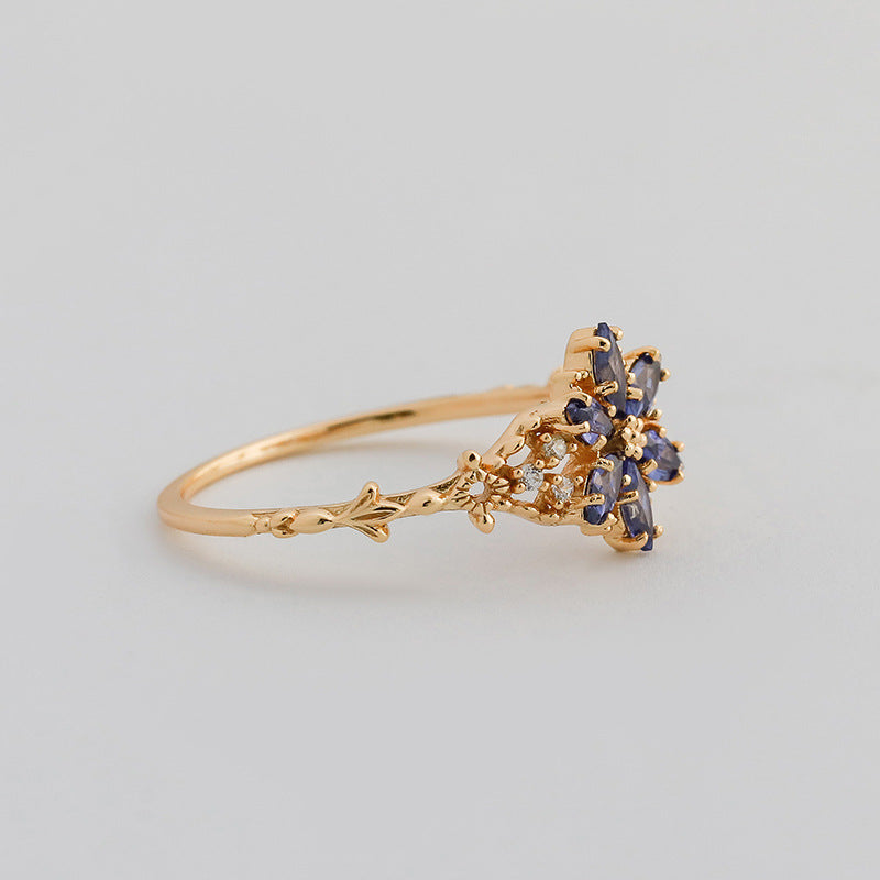 A light luxury Tanzanite zirconium/artificial opal ring